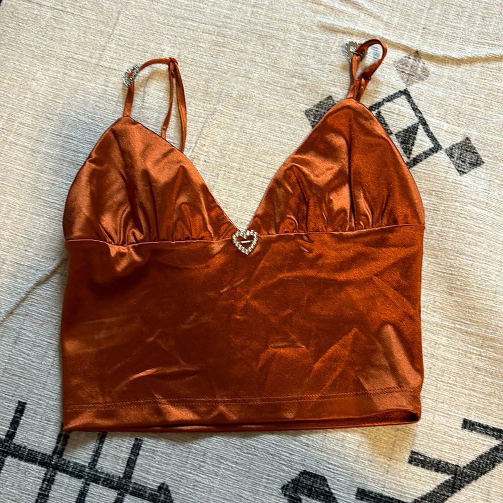 Copper top from Forever 21. Silver heart charms. Size small.
